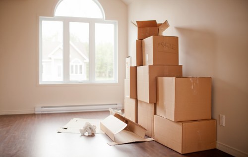 Local office moving team handling furniture and equipment in a North London workspace