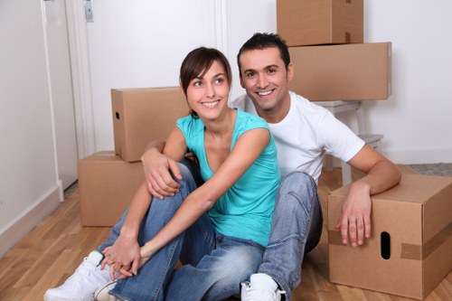 Professional movers handling furniture in a Tufnell Park flat