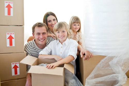 Professional movers handling furniture in a North London property