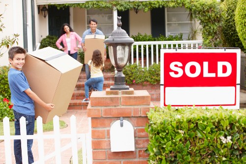 Prepared office relocation scene showing labelled boxes and furniture for a local move