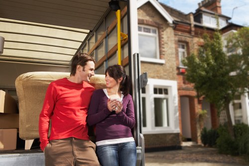 Trained moving staff handling items safely in a residential property