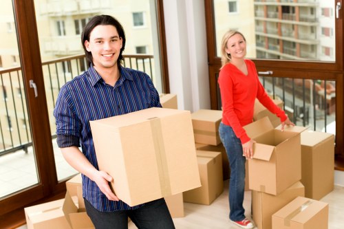Professional removals team handling furniture in a Tufnell Park residential street